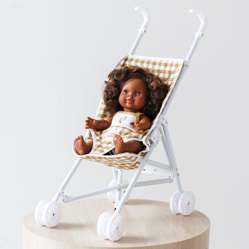 Tiny Harlow Folding Doll's Stroller - Mustard Gingham with African American girl doll sitting in stroller