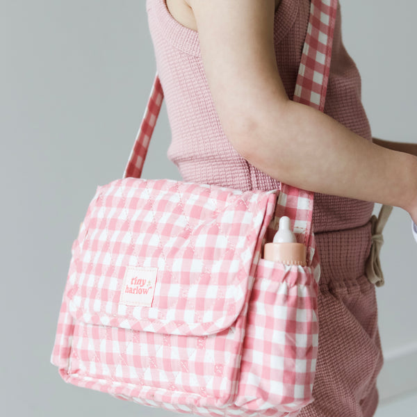 Tiny Harlow Convertible Doll's Diaper Bag set in pink gingham shown as shoulder bag