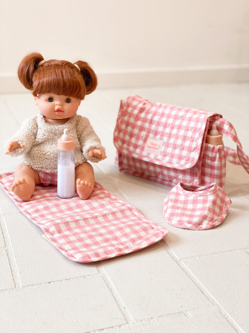 Doll's nappy bag with doll and nappy bag, mat and bib with milk bottle